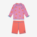 UV Protective Surf Set Pink Starfish, a child's long-sleeved rash guard top with starfish print and coral swim shorts with blue trim.